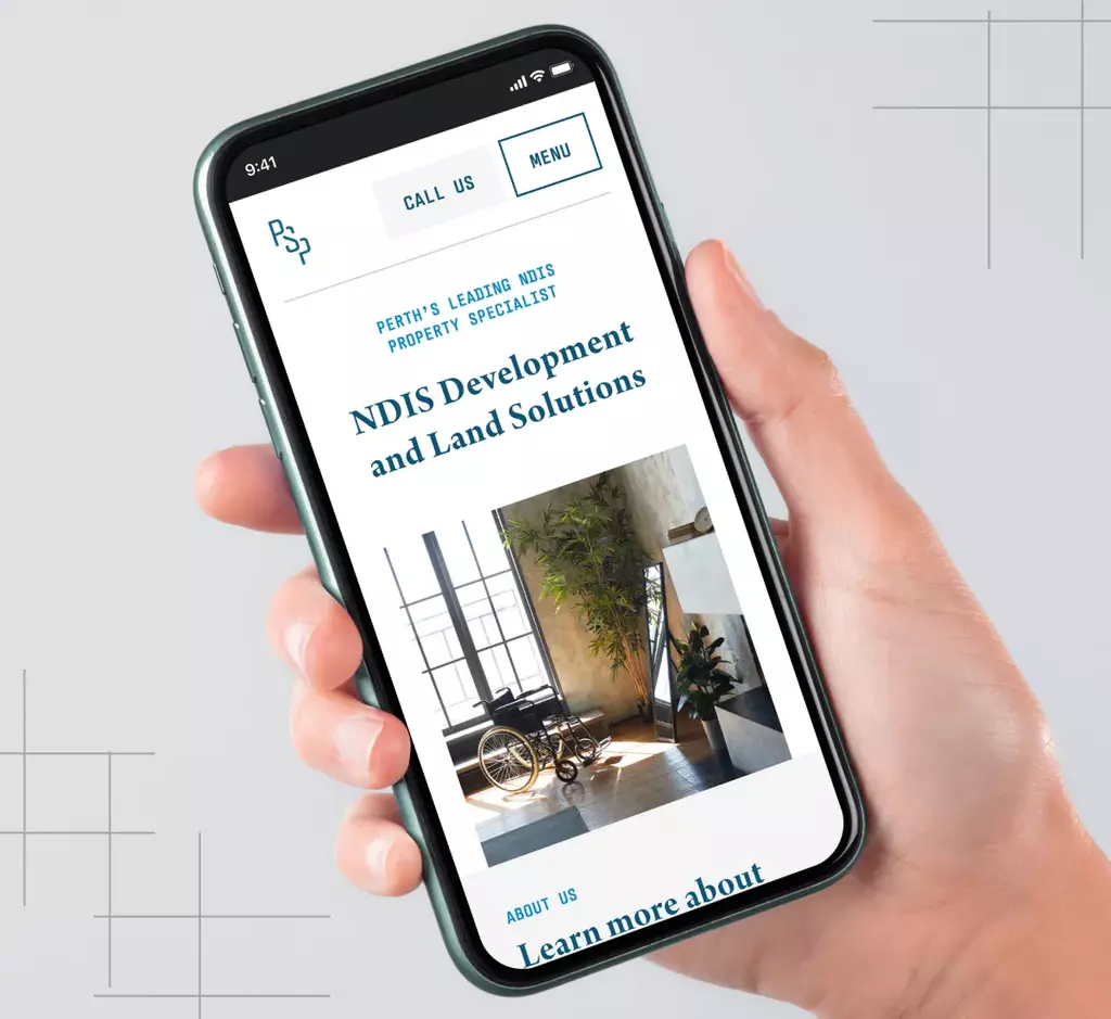 A mockup of a hand holding an iPhone 10 with the Perth SDA Property website on it.